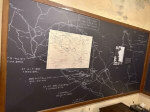 The grim numbers: replica tactical chalkboards detail the desperate final defense deployments.